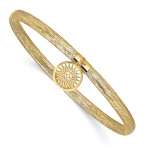 Gold bracelet with intricate circular design.