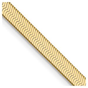 Gold bracelet with wavy line pattern.
