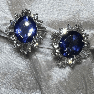 Elegant silver earrings with deep blue gemstones and sparkling accents.