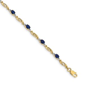 Elegant gold bracelet with blue gemstones.