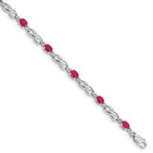 Elegant silver bracelet with alternating red and clear gemstones.