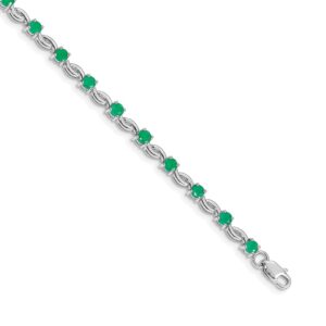 Elegant silver bracelet with green gemstones.