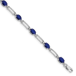 Elegant silver bracelet with oval blue gemstones.