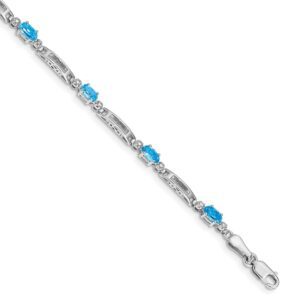 Elegant silver bracelet with blue gemstone accents.