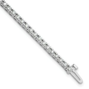 Elegant silver bracelet with a small cross pendant.
